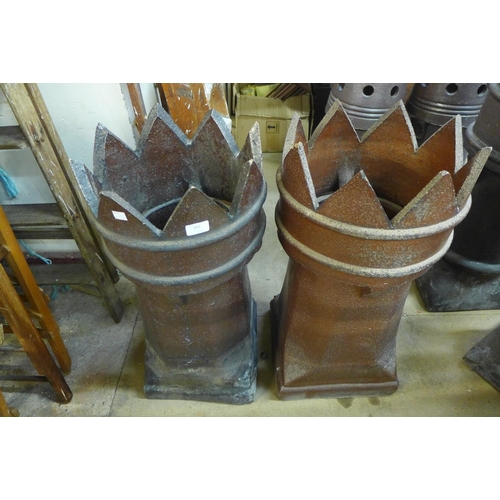 373 - A pair of glazed terracotta chimney pots