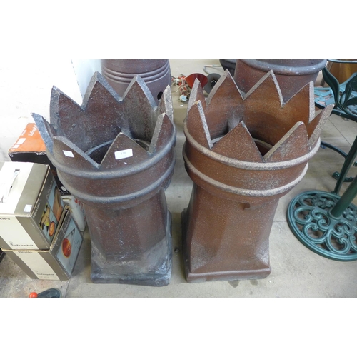 373 - A pair of glazed terracotta chimney pots