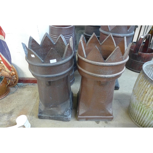 373 - A pair of glazed terracotta chimney pots