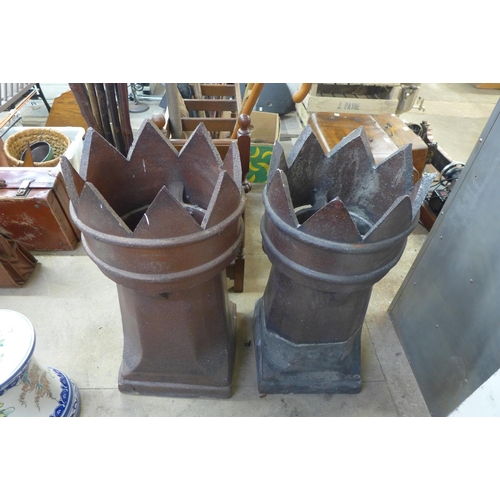 373 - A pair of glazed terracotta chimney pots