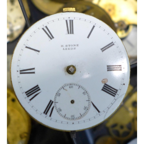 679 - A collection of pocket watch dials and movements