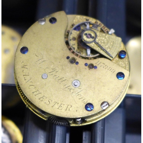 679 - A collection of pocket watch dials and movements