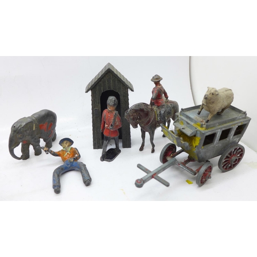 699 - A collection of painted lead figures, etc., including Britains