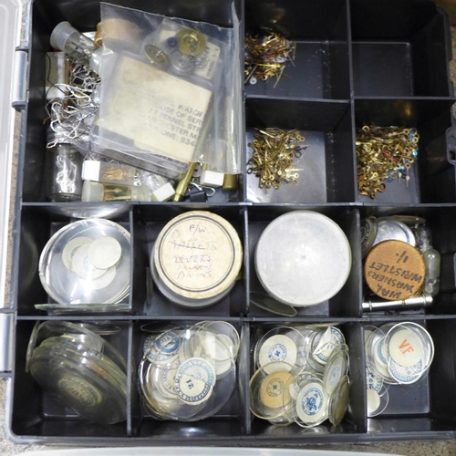 749 - A large collection of watch parts, some tools and clock embellishments