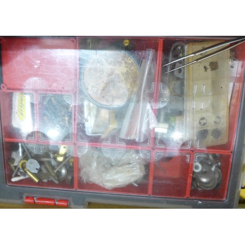 749 - A large collection of watch parts, some tools and clock embellishments