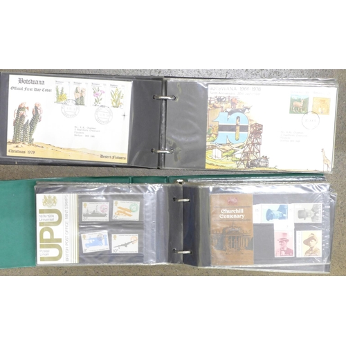 778 - An album of 83 Queen Elizabeth II first day covers, colonial and others and an album of 74 + 4 loose... 