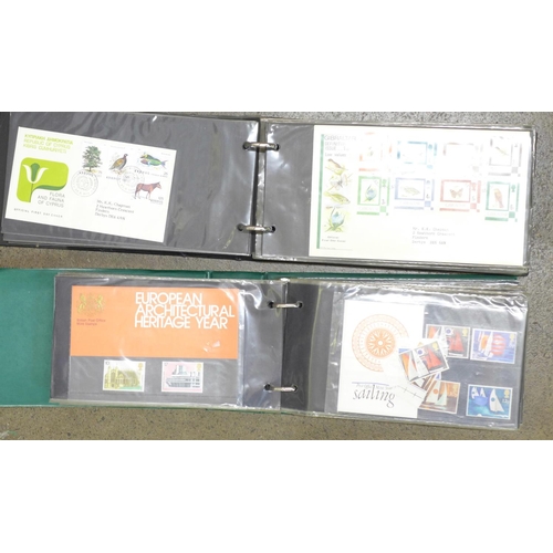 778 - An album of 83 Queen Elizabeth II first day covers, colonial and others and an album of 74 + 4 loose... 