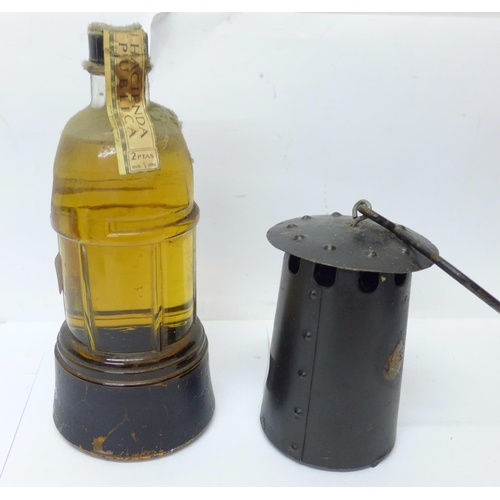 814 - A novelty bottle of brandy in the form of a miner's lamp