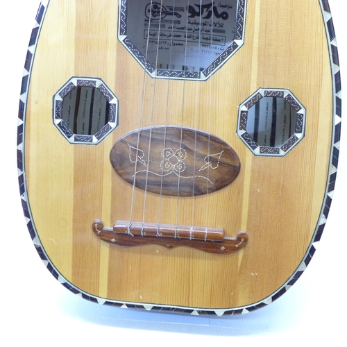 842 - An oud with soft case, a/f (case back and tensioner)