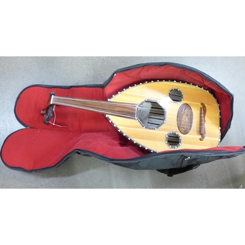 842 - An oud with soft case, a/f (case back and tensioner)