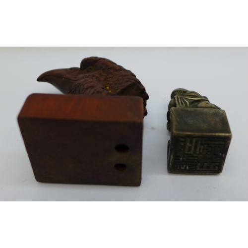 874 - A modern eagle netsuke, signed, a novelty bronze seal and a shingle back lizard fob, (3)