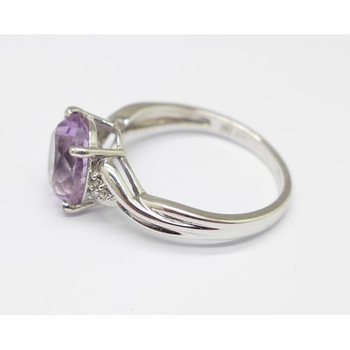 964 - A 9ct white gold and amethyst ring with diamond shoulders, 2.8g, O