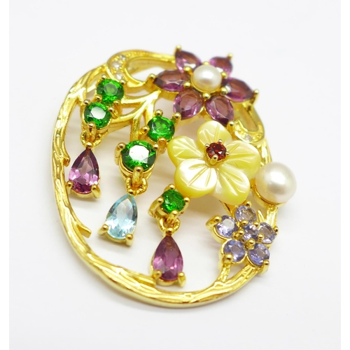 971 - A silver gilt, carved pearl, Russian diopside, amethyst, topaz, tanzanite and zircon pendant