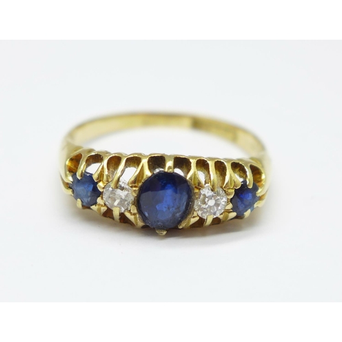 972 - An 18ct gold, blue and white stone ring, 3.8g, O