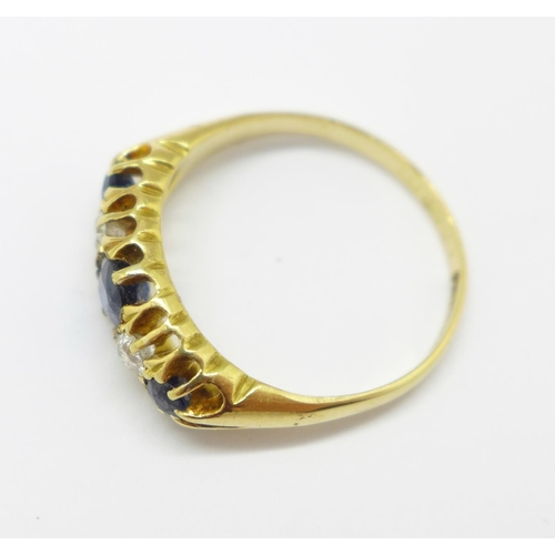 972 - An 18ct gold, blue and white stone ring, 3.8g, O