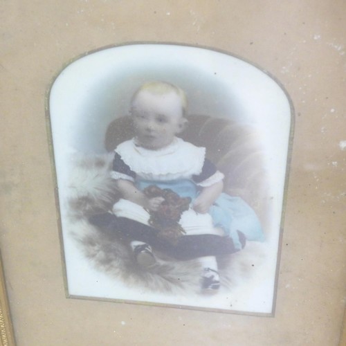 806 - Two gilt framed portraits of children, one on opaque glass, the other an over-painted photograph