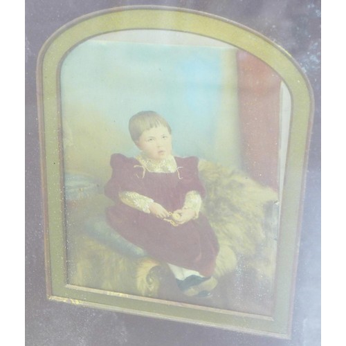 806 - Two gilt framed portraits of children, one on opaque glass, the other an over-painted photograph