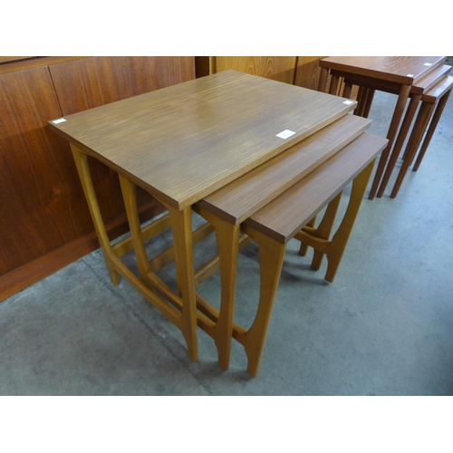 112 - A teak nest of tables