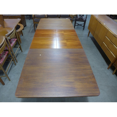 131 - A McIntosh teak double extending dining table