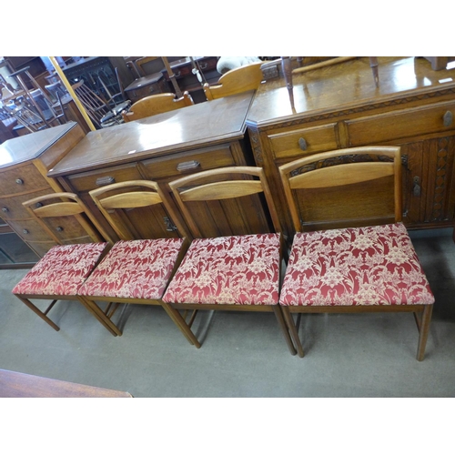 133a - A set of four teak dining chairs