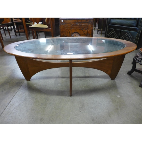 134 - A G-Plan Astro teak and glass topped oval coffee table