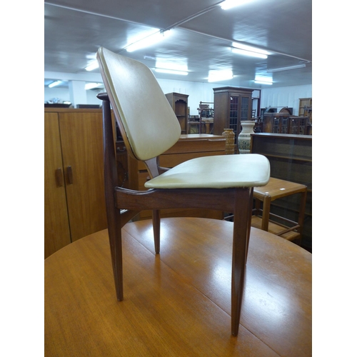 138 - A set of four Elliotts of Newbury teak and vinyl dining chairs