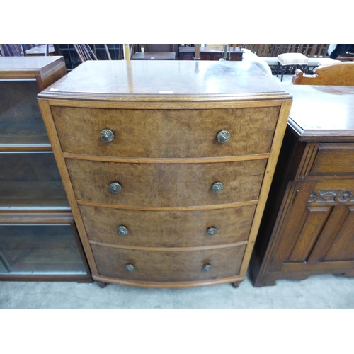 174 - A burr walnut bow front chest of drawers