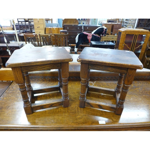 176 - A pair of oak stools