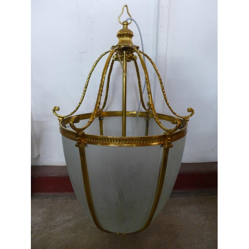 194 - A pair of large French style gilt metal and glass panelled ceiling lights