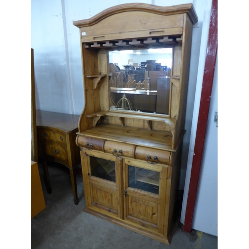 197 - A pine tambour front wine/cocktail cabinet