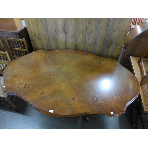 204 - An Italian Sorrento walnut and marquetry effect dining table