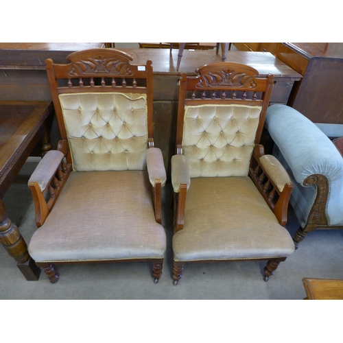 224 - A pair of Victorian carved walnut and upholstered armchairs