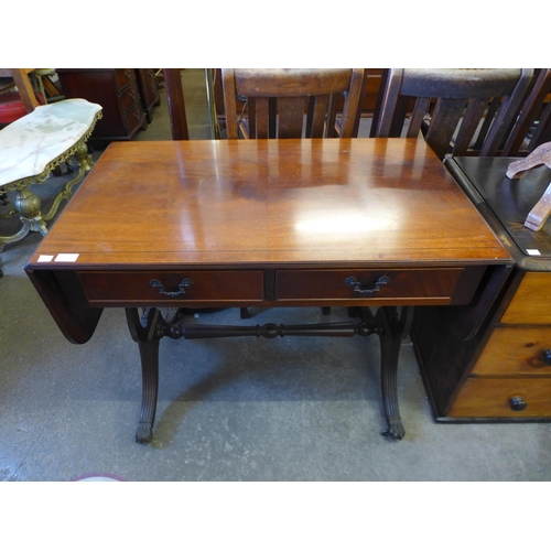 233 - A Regency style inlaid mahogany sofa table