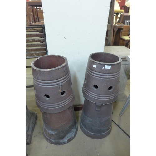 372 - A pair of glazed terracotta chimney pots