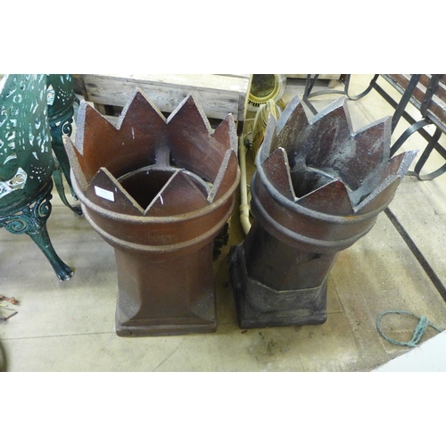 373 - A pair of glazed terracotta chimney pots