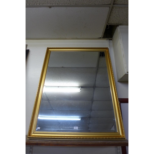 419 - A gilt framed mirror