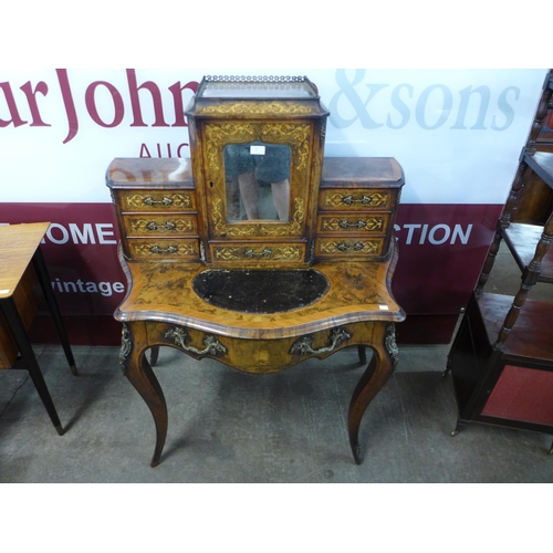 90 - A Victorian walnut, ormolu mounted and marquetry inlaid bonheur du jour