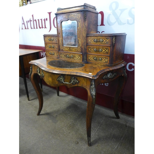 90 - A Victorian walnut, ormolu mounted and marquetry inlaid bonheur du jour