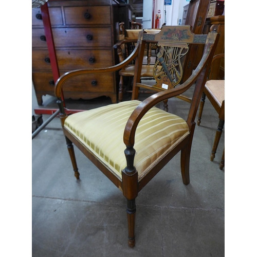 94 - A set of three Sheraton style painted satinwood elbow chairs