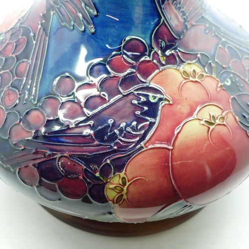 610 - A Moorcroft Finches and fruit vase and stand, 19.5cm