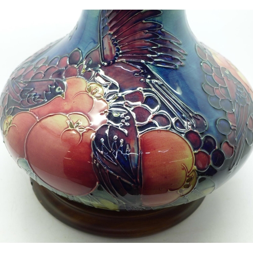 610 - A Moorcroft Finches and fruit vase and stand, 19.5cm