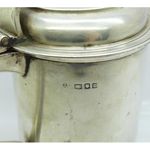 666 - A George II style silver lidded tankard, with a shaped hinged lid and scrolled thumb piece, hallmark... 