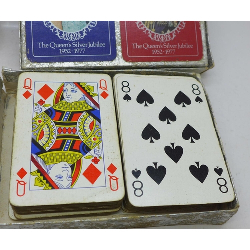 667 - Five packs of playing cards and a compact