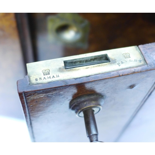 675 - A late 19th Century burr walnut campaign cigar box with original Bramah lock and key and brass reces... 