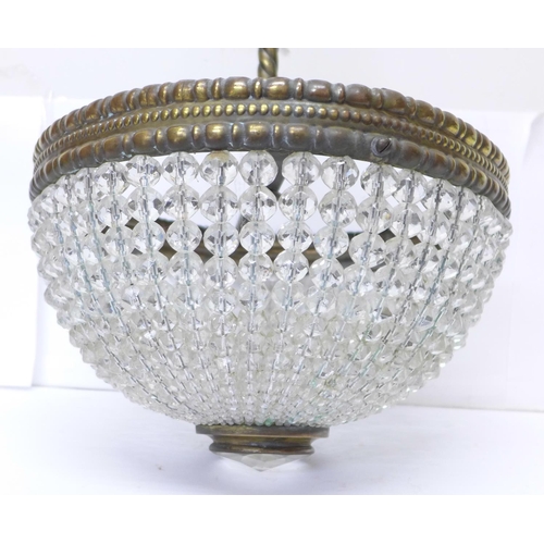 678 - A Victorian crystal ceiling light chandelier, the domed shade formed of graduated faceted crystal be... 