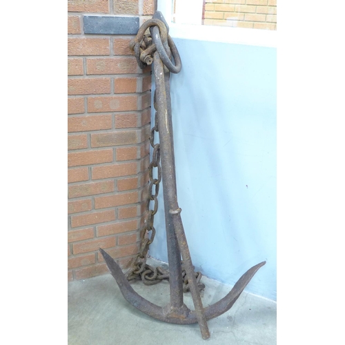 684 - A large iron ship's anchor with chain