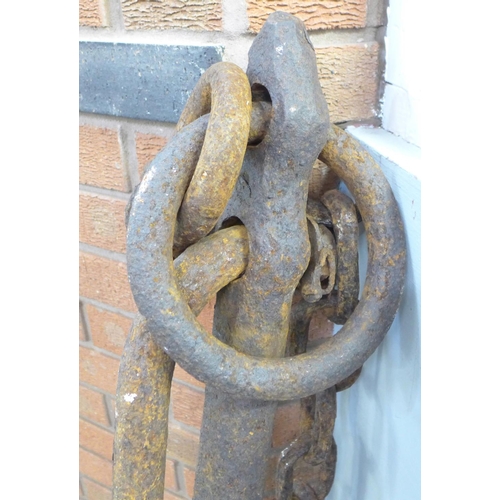 684 - A large iron ship's anchor with chain