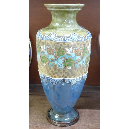 686 - A Royal Doulton vase, a Poole vase and Poole seal