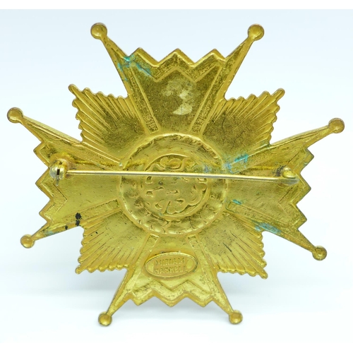 690 - A Miriam Haskell early 1950's brooch in the form of a Maltese cross with large blue paste stone to c... 