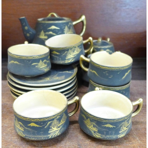 691 - A Japanese tea set with teapot, cream and sugar, one cup a/f